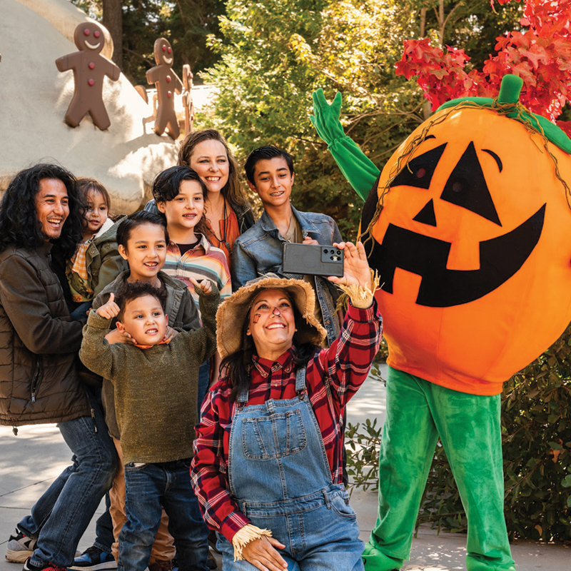 A family taking a selfie at Pumpkins in the Pines